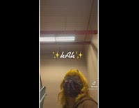 Girl in stair hallway making anime noise