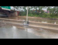 Cars on opposite lane on highway stuck because of flood 