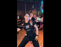 Employee dancing while serving shots 