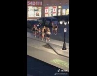 Girls walking through parking lot 