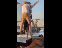 Old couple titanic pose filmer under them