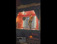 Shirtless guy dance inside bar at NYC 