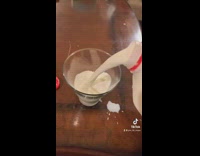 Girl with boo halloween oreos in milk