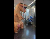 Inflatable dinosaur costume spins metal pole train