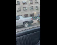 Man drives bicycle exhibition along the street 