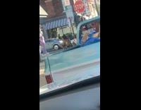 Pt. 2 Influencers look at pictures in front of purple building 