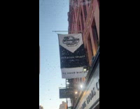 Machine on building window produce spread snow