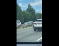 Car bumper attached to window as wings