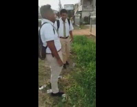 Two guys retrieve white ball grass hill 