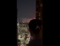 Fire visible inside room on building night