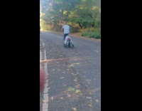Dad pedals bicycle while kid lays on seat pt. 2