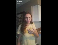 Girl spills drink out of bottle and spills water on face, friend helps her get back up 