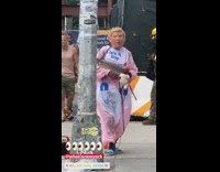 Donald Trump impersonator wears baby diaper costume on the sidewalk