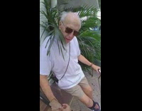 Guy gives sliced meat to an old man