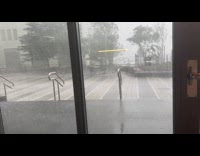 Submitter shows strong thunderstorm from outside building