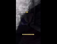 Woman placing hand on dog to pose