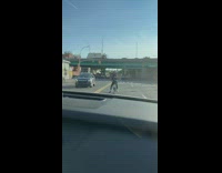 Homeless man rides his bike and carry heavy things