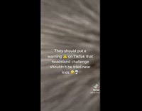 Mom attempts headstand lands on toddler fail 