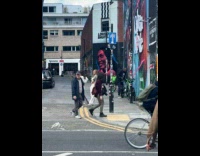 Collab IITW - Woman in white crop top poses in front of the graffiti art