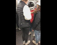 Red Astronaut Space Suit on Subway 