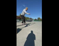 Guy skateboards on rail and falls