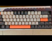 Normal keyboard on space bar of giant keyboard