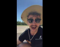 Guy on side of road finds orange kitten cat 