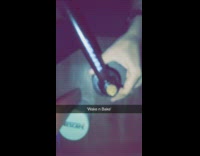 Guy white voodoo dolls lighter smokes