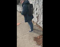 Whole pizza on sidewalk 