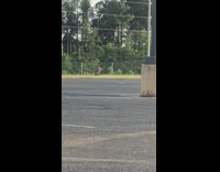 Guy takes photo white van parking lot