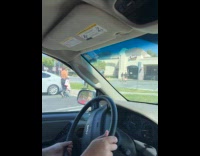 Two guys in wetsuit walk towards Canes