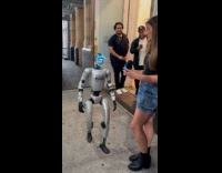 Woman trying to interview robot but fails