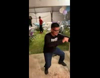 Guy bends down while dancing loses balance and falls