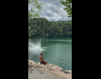 Wetsuit guy double backflip rope swing lake