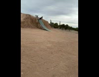 Guy rides a tiny motorcross bike up a ramp but falls on ramp after