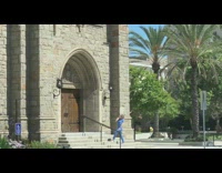 Blue scrubs lady stone building phone tripod 