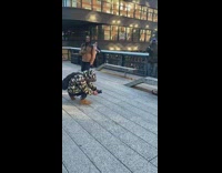 Couple weird pose metal bench camouflage jacket