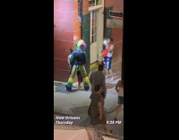 New Orleans clown woman corner street