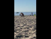 Woman kneel and bend backwards selfie beach