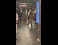 2 men transports table dresser on subway 