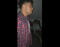 Group of guys singing karaoke together 