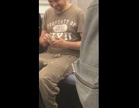 Man molds a clay dinosaur figure on subway train