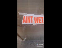 Guy touches dry paint, rips wet paint sign then says aint wet