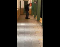 Guy wearing hat with fur dances alone 