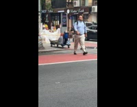 Woman pushes cart with woman on it