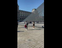 Girl black skirt hair flip glass pyramid