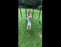 Baby girl falls off swing after her sister pushes her too hard from behind