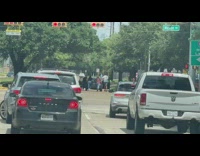 People push car open door on street