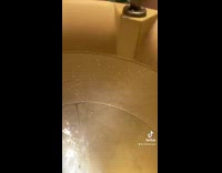 Guy goes down yellow water slide 