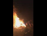 Guy jumps through campfire 